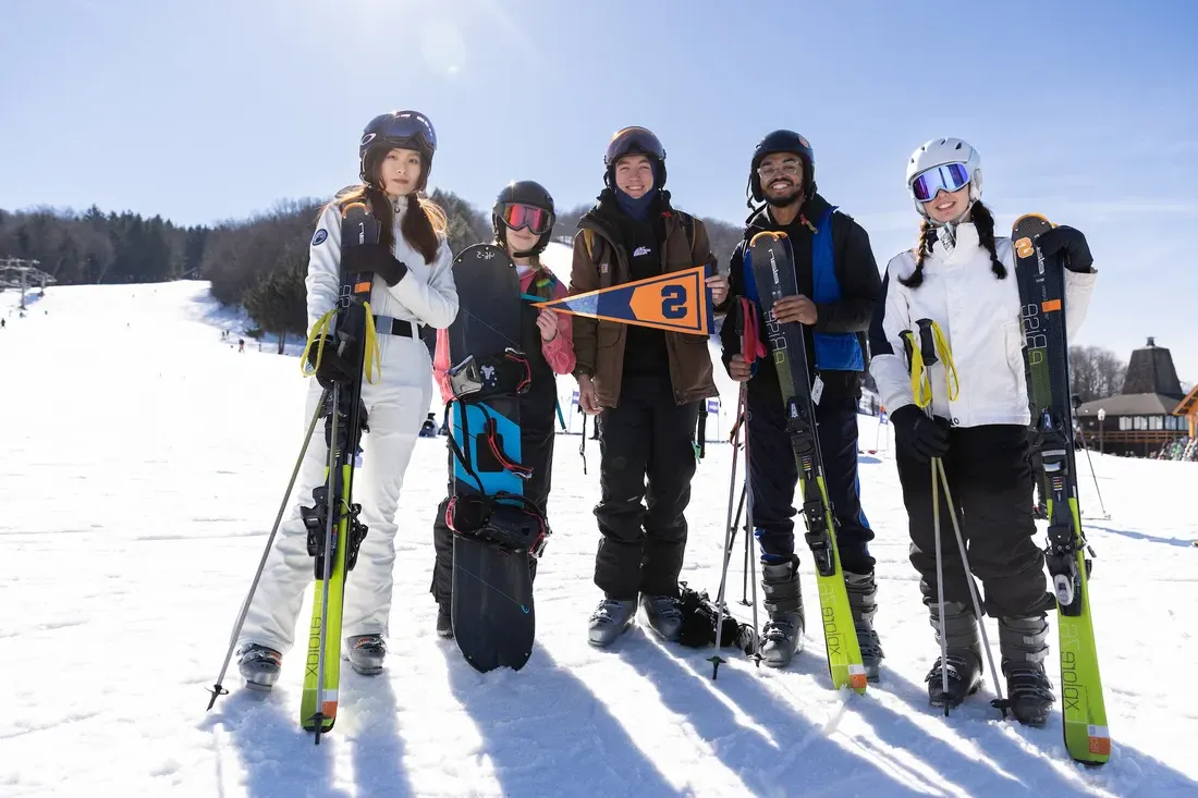 Students skiing at Song Mountain during the winter.